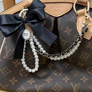 Elegant Pearl and Chain Bracelet with Black Bow